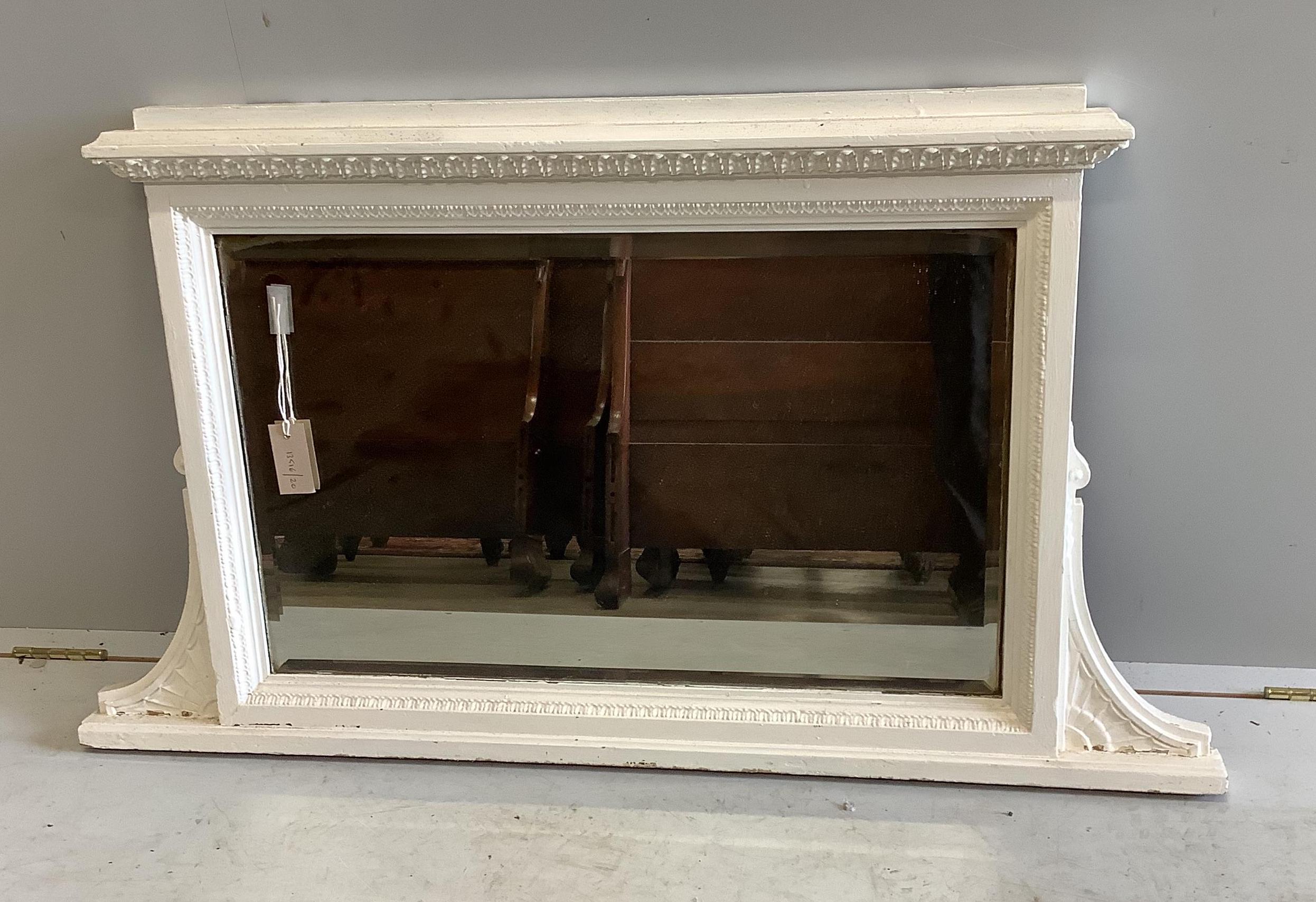 A late Victorian overmantel mirror, later painted, width 112cm, height 64cm